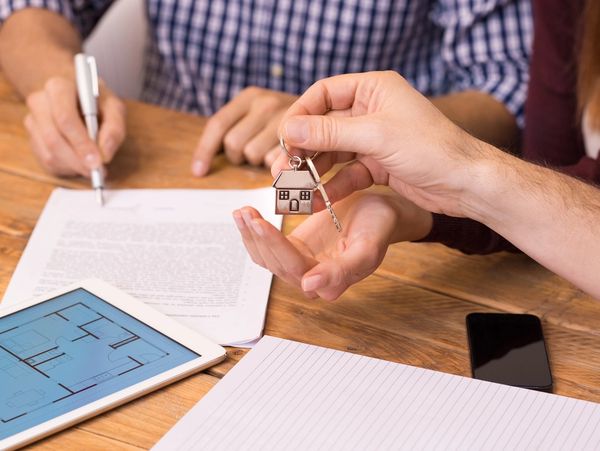 a man receiving the keys to a house.