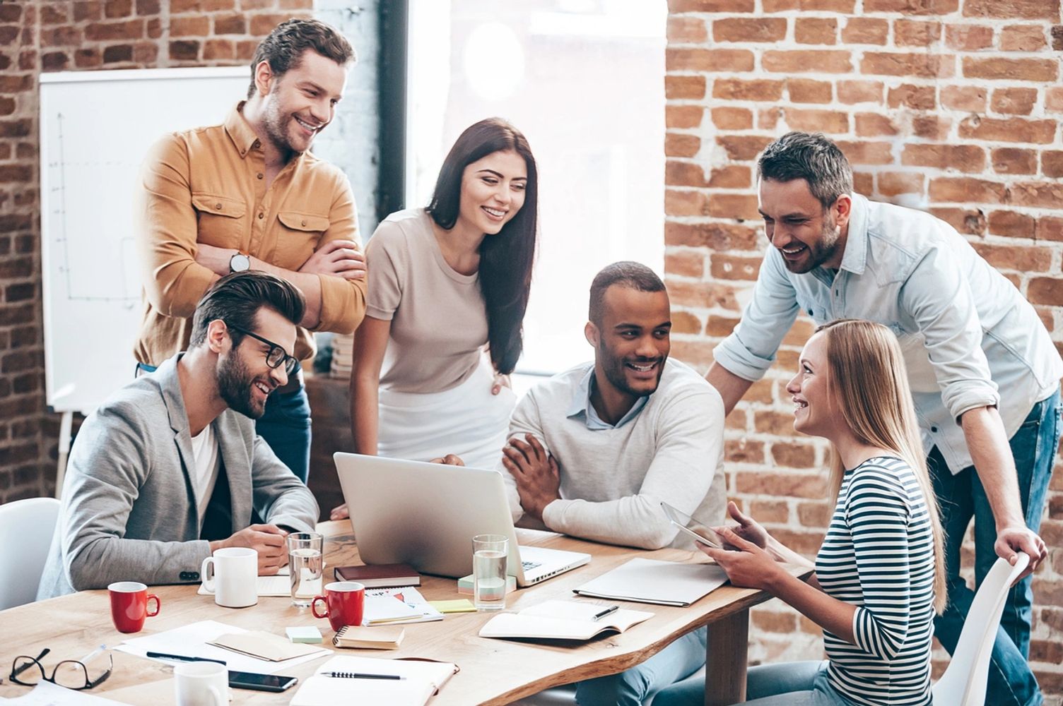 diverse millennials at conference table