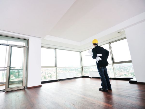 A professional making an inspection inside a house