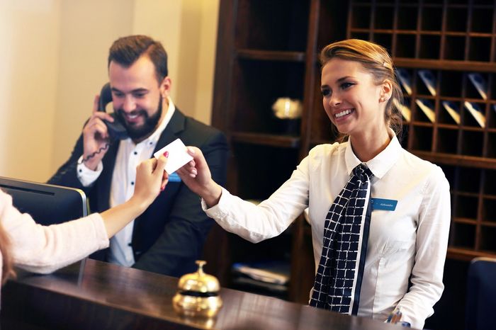 hotel service smiling to greet guest