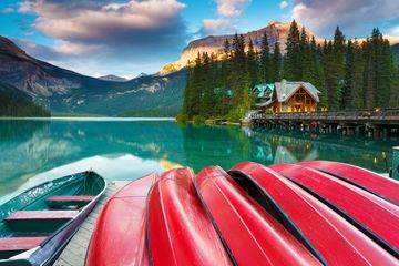 Red Oar Writing canoes on a lake 
