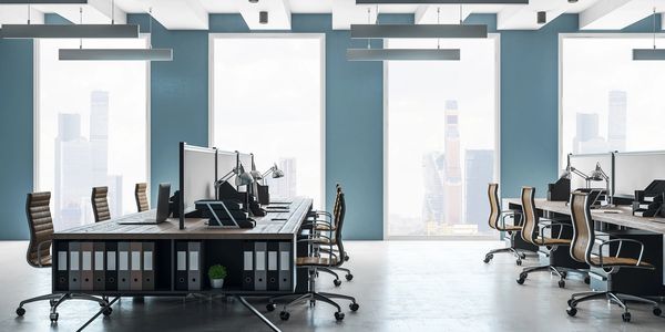 office with desks, computers, and chairs