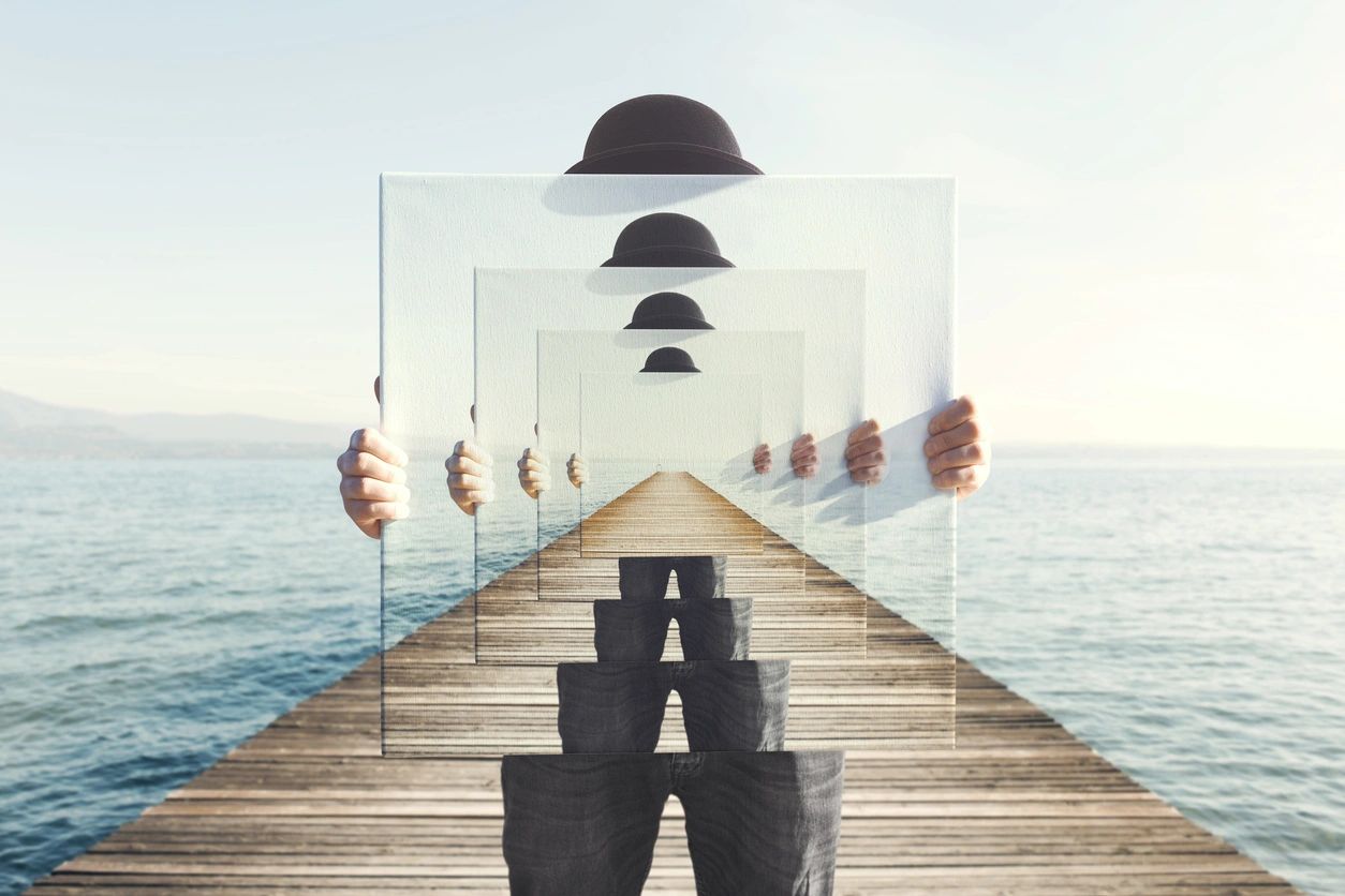 Person holding a recursive painting of themselves on a pier by the sea.
