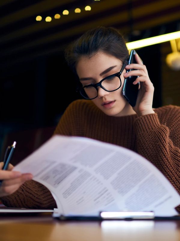An accountant reading through figures and paperwork