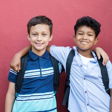 Two boys with their arms around each other