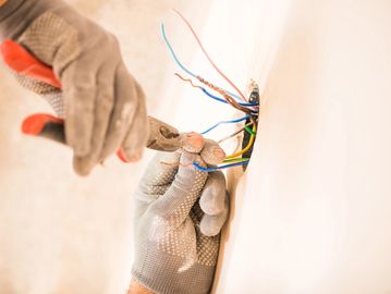 Electrician cutting electrical wires