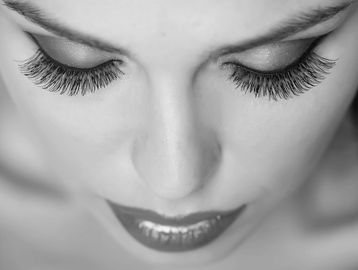 Woman with Eyelash extensions and red lips