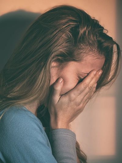 Person experiencing relief and grounding during PTSD therapy in Denver focused on trauma recovery.