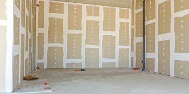 Plastering a room under construction