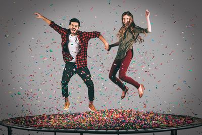 Two people jumping in excitement, pelvic floor rehabilitation
