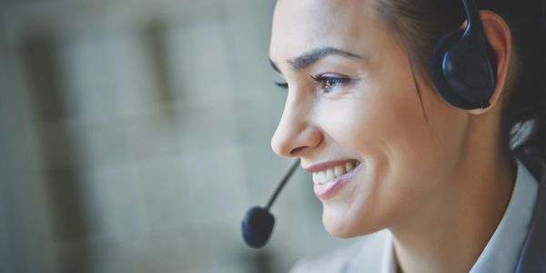 Woman with headset smiling