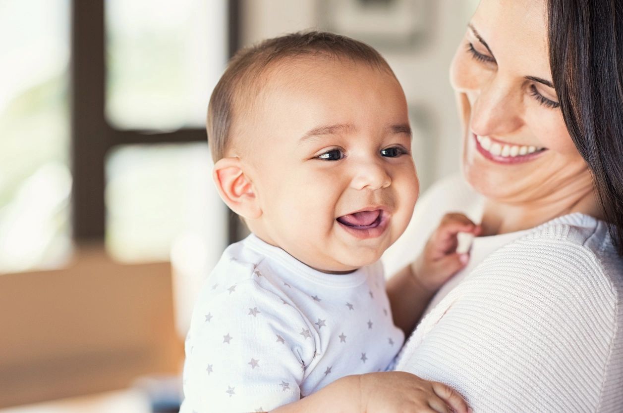 A mother and her smiling baby