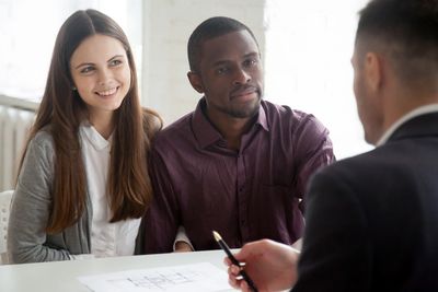 Property Management, Landlord and Tenants speaking at a desk.