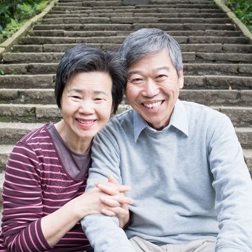 An older, smiling couple