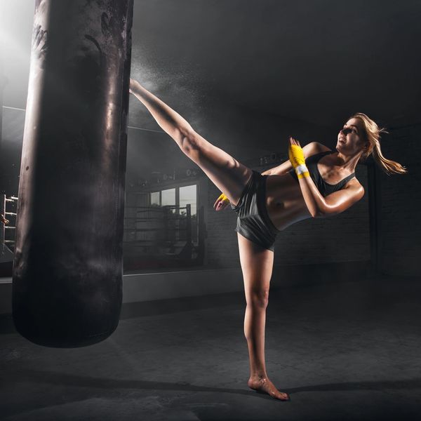 Woman kickboxing.