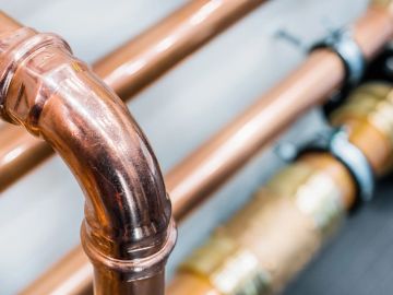 Close-up of copper plumbing pipes.
