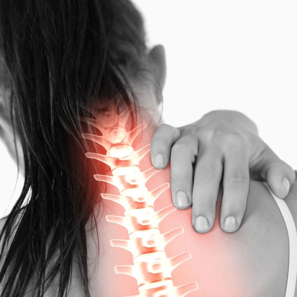 Woman with highlighted neck spine experiencing pain, holding shoulder.