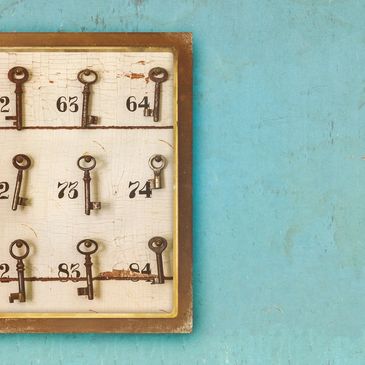 Antique keys hanging from hooks represent that you have the keys to designing a coaching package.