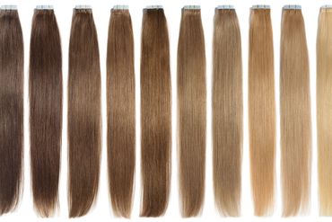Hair extensions in various brown to blonde shades.