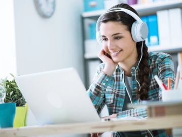 Young woman looking at laptop