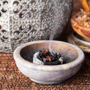 Burning sage in a bowl
