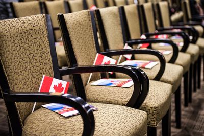  Canadian flag and a brochure on each chair