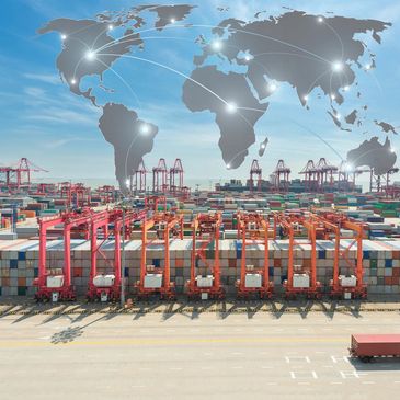 A busy shipping port with containers, cranes, and a digital world map showing global connections.