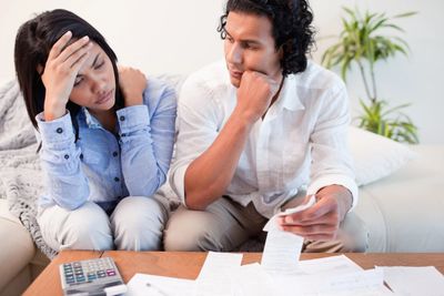 man and women going over bills due