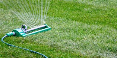 Stock photo: Sprinkler watering manicured lawn with stripes in Park Circle (example)
