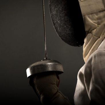 closeup shot of a person wearing a fencing costume 