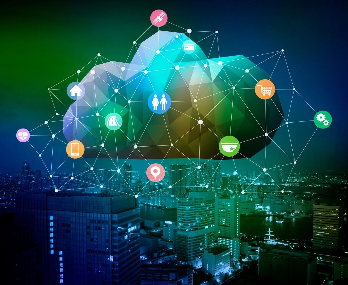 Digital cloud network connecting various smart city icons over a nighttime cityscape.