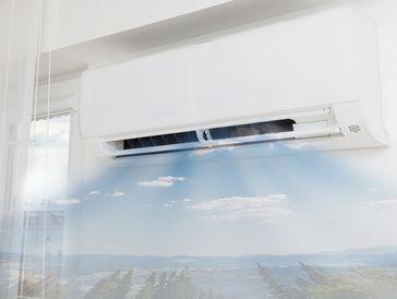 air-conditioner blowing air with picture of sky and clouds 