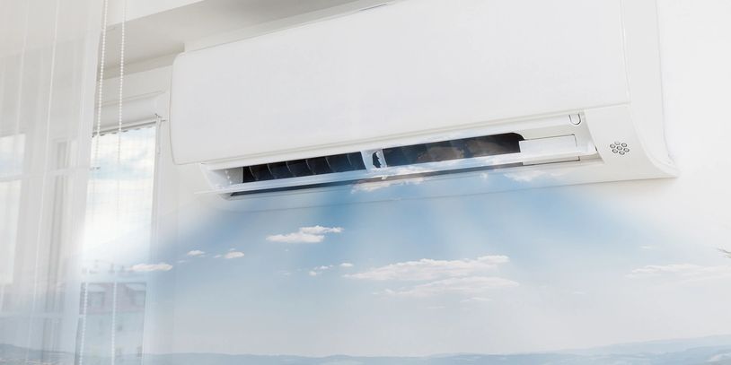 Professional technician installing a residential air conditioning unit