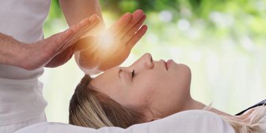 Hands on Reiki energy healing of the chakras. Clearing blockages and promoting healing.