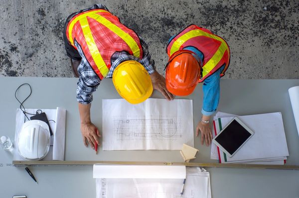 two construction workers working