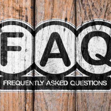 FAQ on wood background.