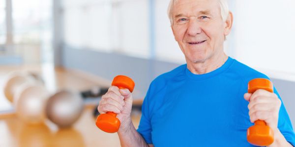 an old man with small dumbbells