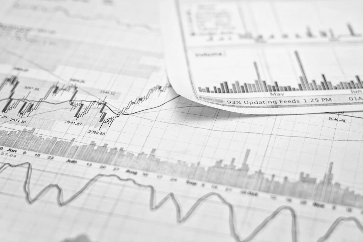 Financial charts and graphs showing stock market data and trends.
