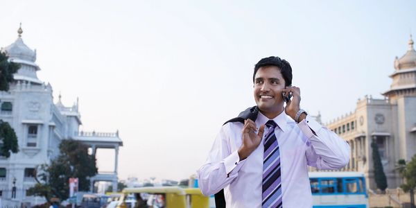 Professional man talking on phone outdoors.