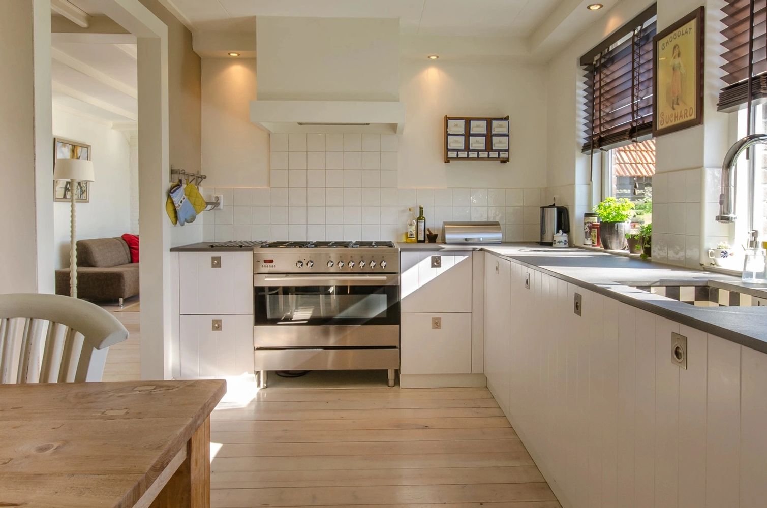 Kitchen Remodel Cabinets and Countertops Tile Backsplash Wood Flooring  Appliances Lighting Fixtures