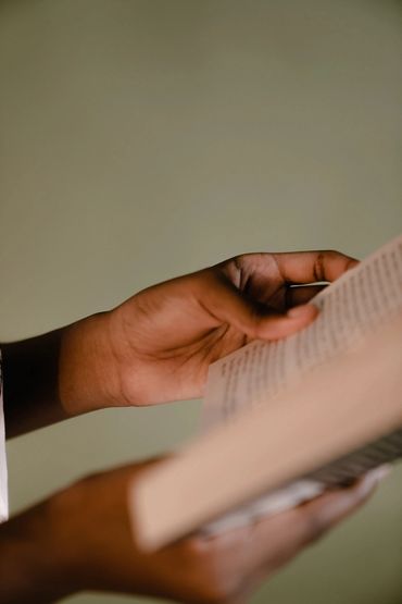 the hands and book for someone reading