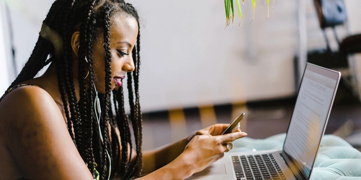 Young woman looking at her smart phone