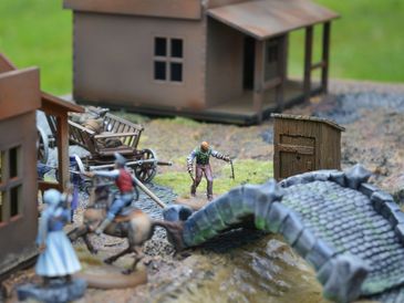 An image of people using minis to play a tabletop game.