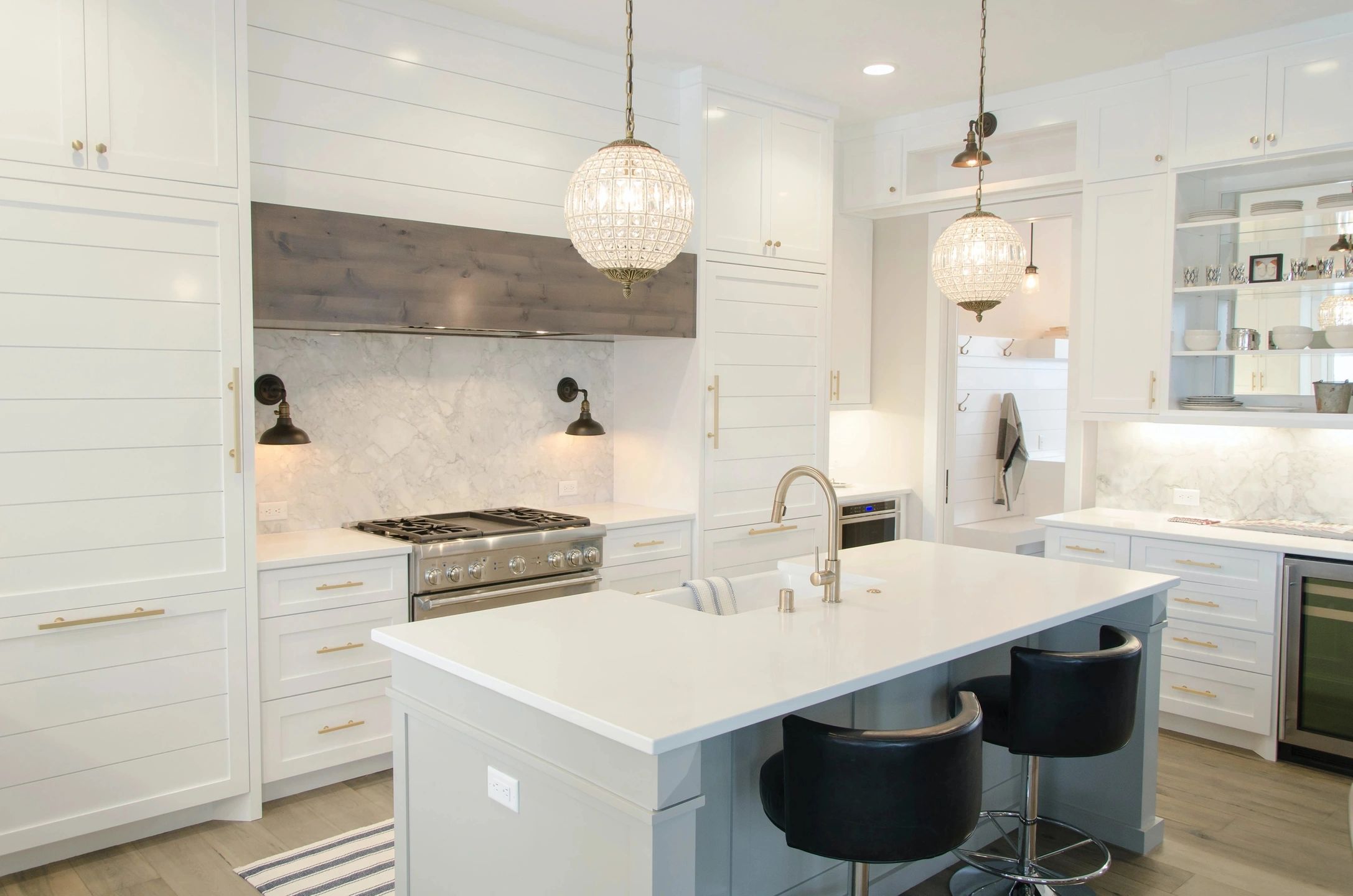 Kitchen painted in clean white with light grey accent on the center island.