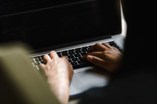 Man typing on keyboard