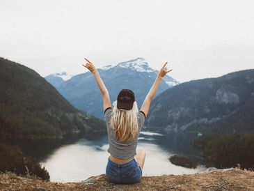 woman posing at the edge of a cliff