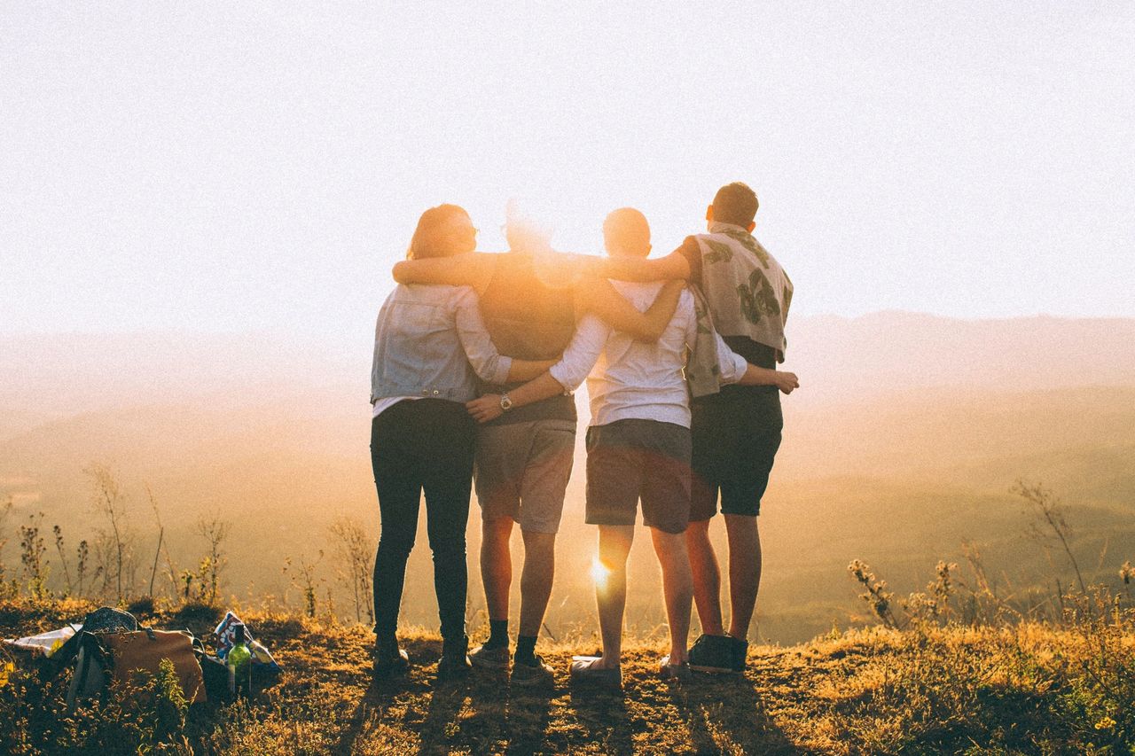 Group enjoying a healthy lifestyle at sunset