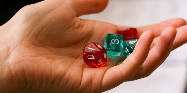 Stock image of a hand holding dice