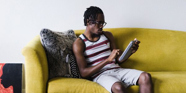 Man using wifi internet on his couch