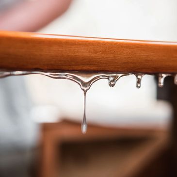 A picture of water on the wooden table